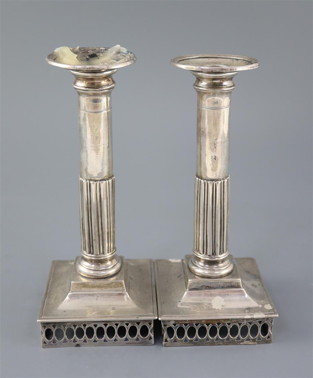 A pair of early 19th century Spanish silver candlesticks, c.1800, ships bases